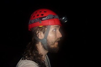 the author in cave wearing hard hat