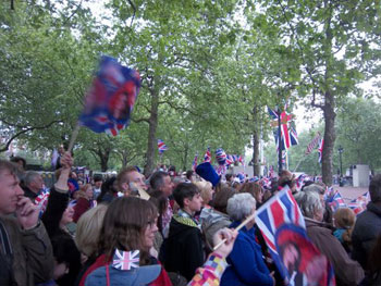 well-wishers waving flags