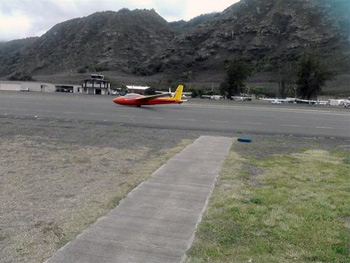 glider plane landing on runway