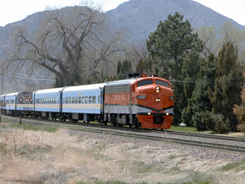 vintage diesel railroad engine pulls train