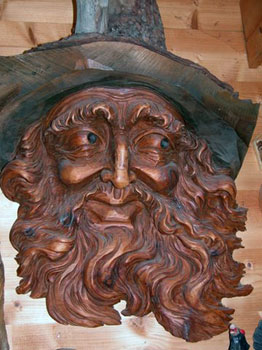 wood carving of man's face