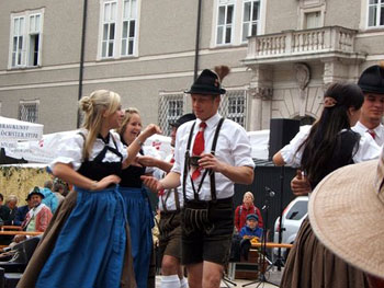 Salzburg locals wearing lederhosen and dirndls
