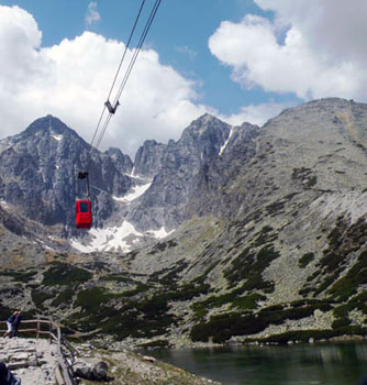 cable car in front of mountains