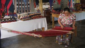 woman weaving at cooperative