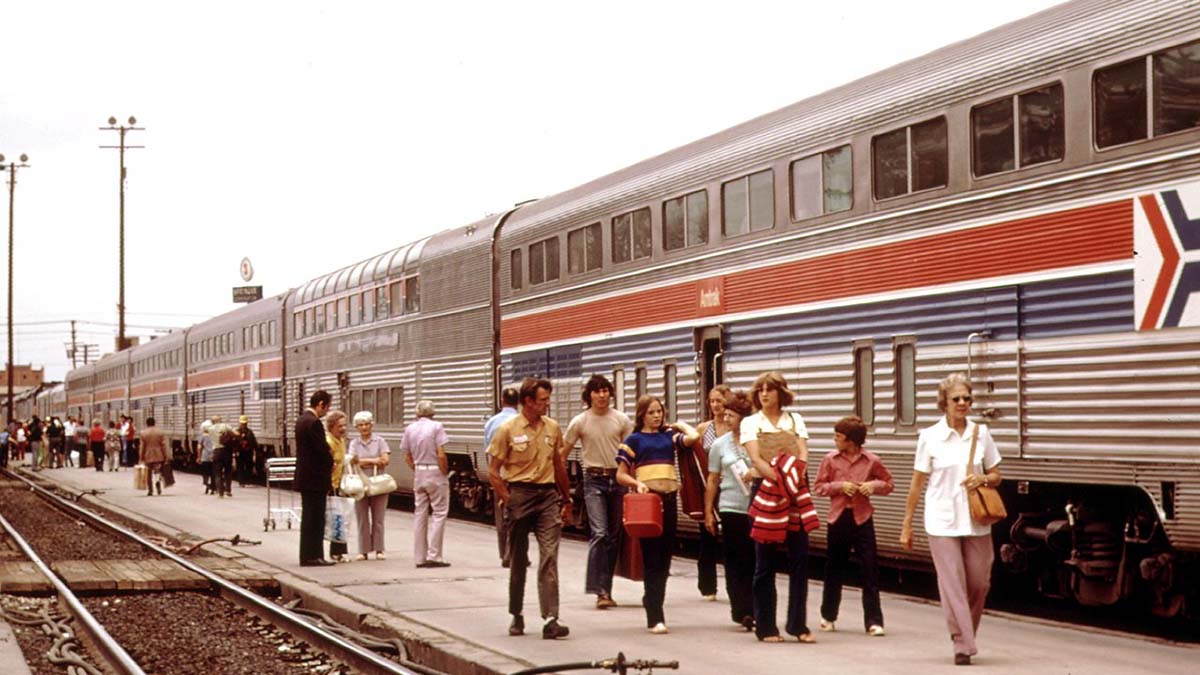Amtrack train and passengers in station