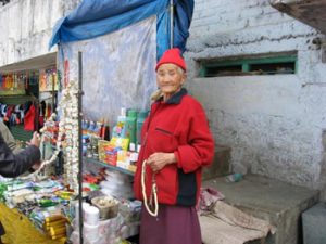 Tibetan woman selling jewelry