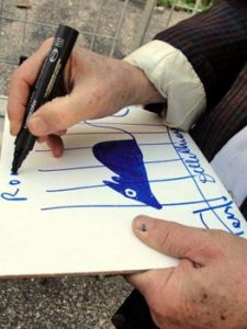 Fausto autographing a drawing