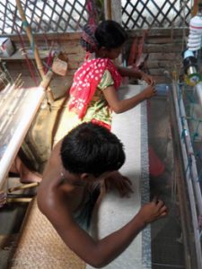 workers making a Jamdani sari