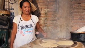 Oaxaco woman making tortillas