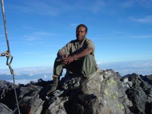 guide at top of Mt. Wilheim in PNG