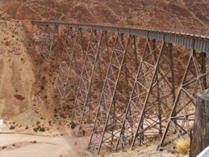 railway trestle crosses high over desert canyon