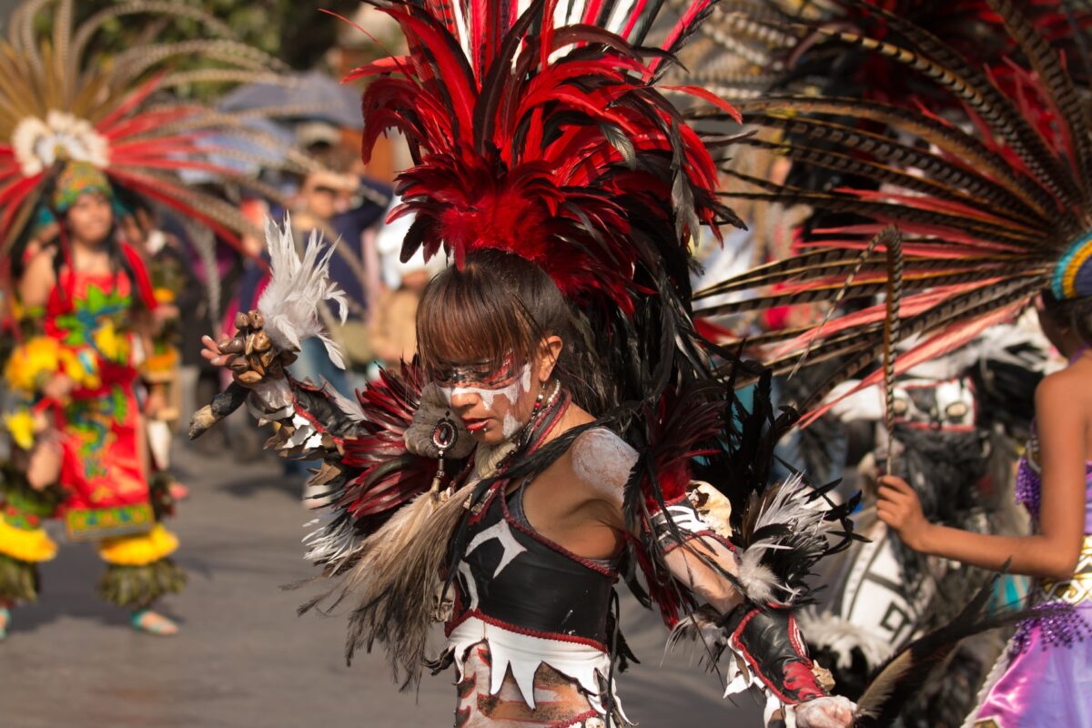 A woman dancing at a carnival that explores the culture and history of the Caribbean.
