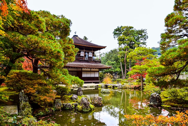 View of the Golden Pavilion near a body of water.