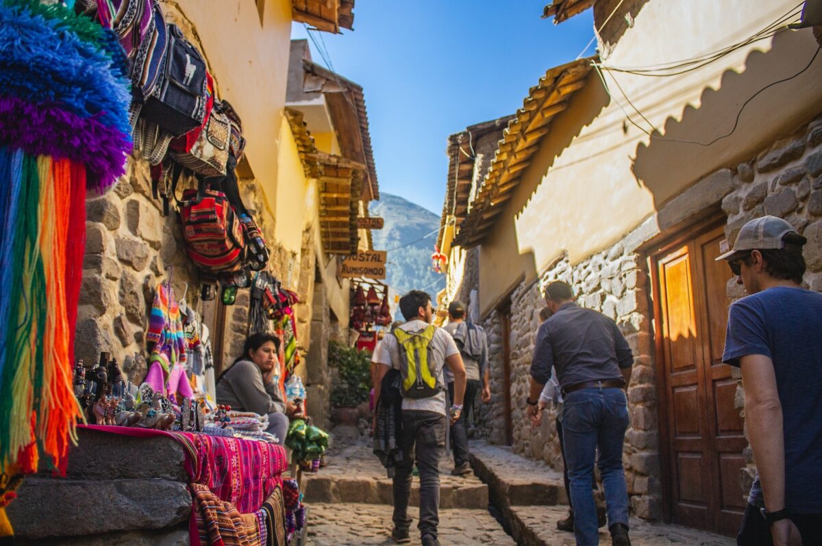 a person walking the cobblestone streets of Cusco