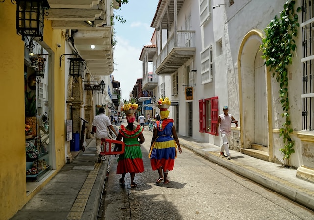 Two women walking down the street in Cartagena
