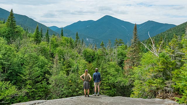 man and woman hiking in Adirondacks