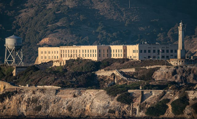 Prison building with mountains behind it