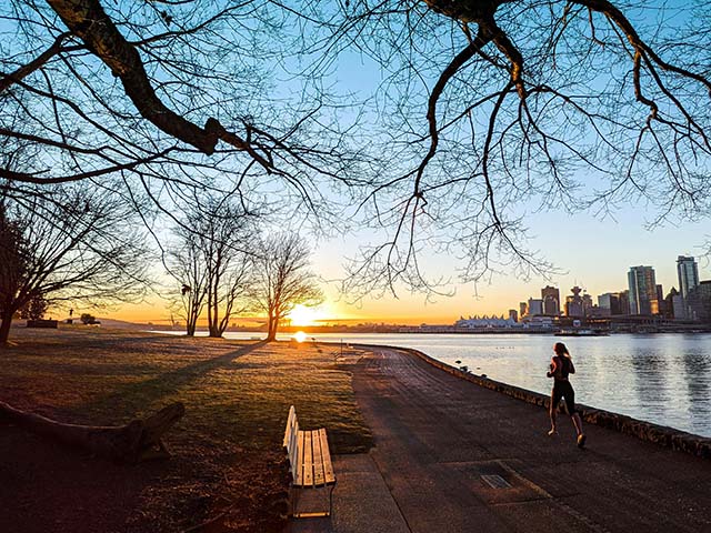 jogger on seawall in Stanley Park, Vancouver