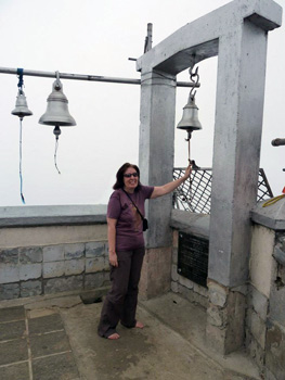 the author ringing bell at mountain top