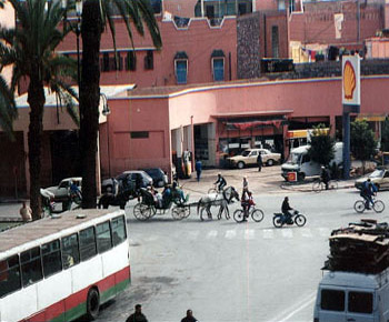 Marrakech street with calèche (horse-drawn carriages)