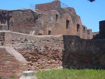 arched building behind wall in Ostia Antica