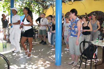 tourists learning salsa dancing