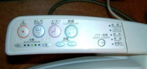 control buttons on Japanese toilet