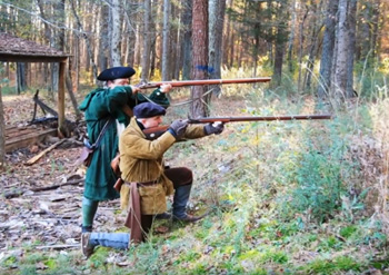 Colonial reenactors showing winter hunting gear