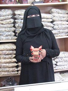 Omani woman in shop