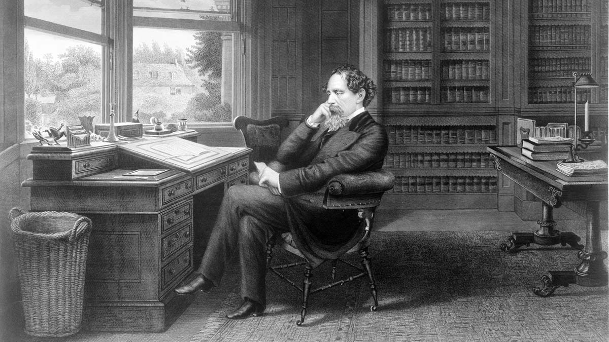 Charles Dickens at his writing desk