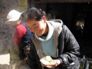 holding Tibetan potato dumplings