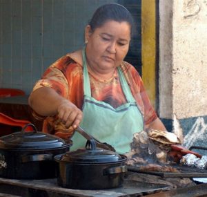 woman cooking in Mexican restaurant