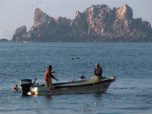 fishermen in a boat in Melaque harbor