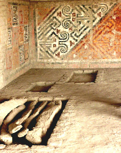stylized geometric images on wall of tomb
