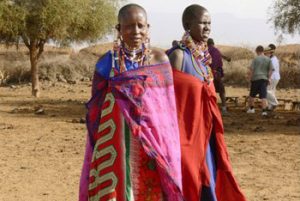 Masai men in colorful tribal wardrobe