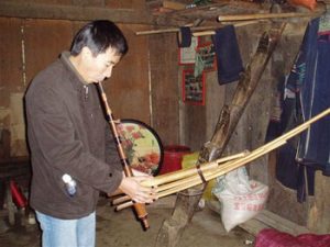 Ting playing ken instrument