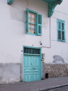 turquoise door of house in Centrum