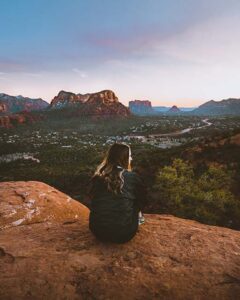 Woman sitting on rocks in Sedona, Arizona