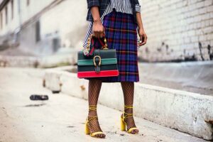 stylish woman carrying a handbag