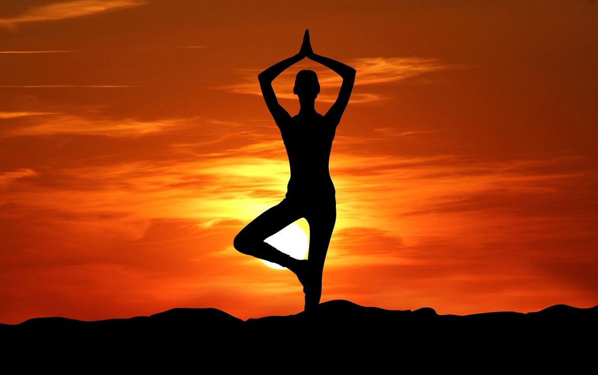 woman doing yoga at sunset in Sedona