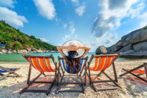 summer packing essentials woman in beach chair