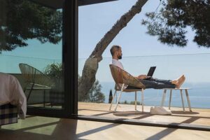 man using laptop outdoors