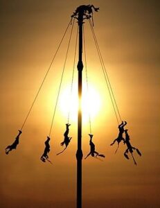 pole dancers at sunset