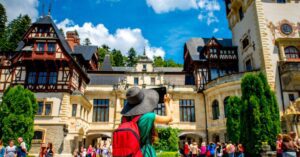 female tourist framing a travel photograph