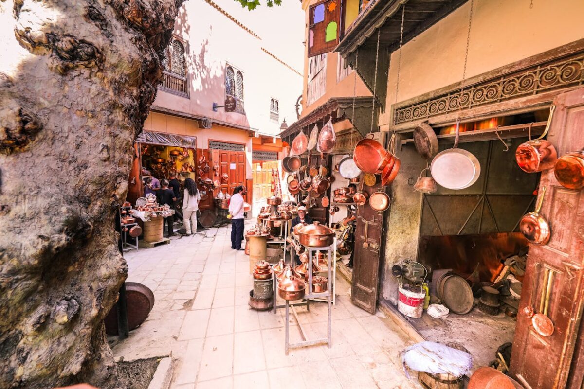 Copper pots and pans in a shop, local cookware hanging on the walls
