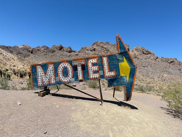 large motel sign in the desert